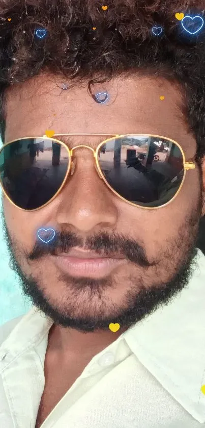 Portrait of a stylish man wearing sunglasses with a colorful background.