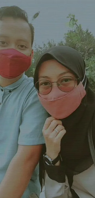 Couple wearing stylish face masks in an outdoor setting.