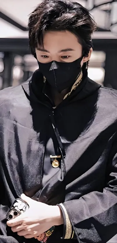 Stylish person with a black face mask in a modern setting.