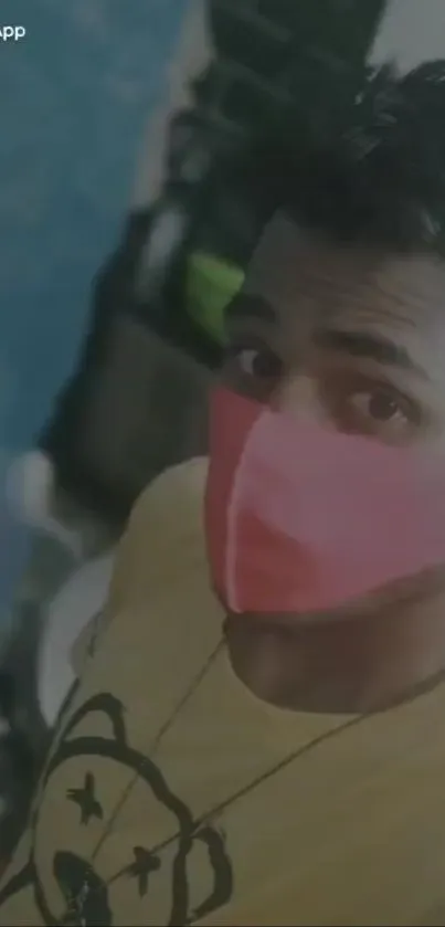 Stylish selfie with pink mask and yellow t-shirt design.