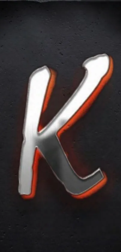 3D metallic letter 'K' with orange accents on dark background wallpaper.