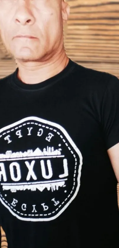 Black t-shirt with bold typography graphic design.