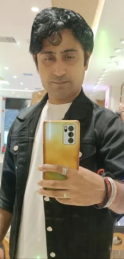 Stylish mirror selfie in fashionable store setting.