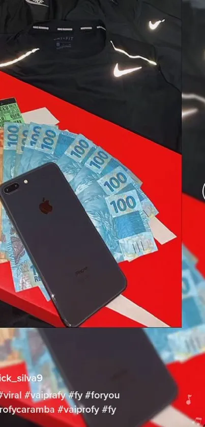 Black mobile phone on red surface with colorful Brazilian currency.