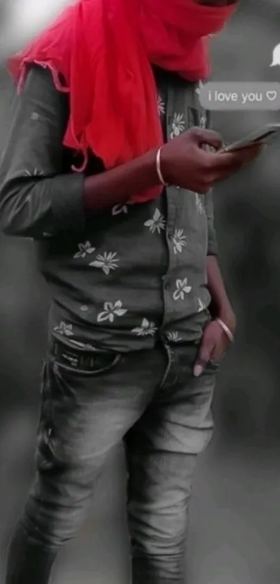 Stylish youth with red scarf holding phone