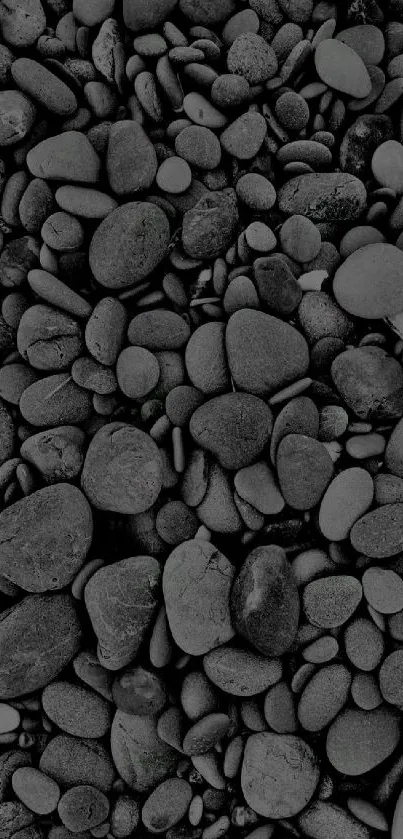 Monochrome pebble wallpaper with dark smooth stones for mobile.