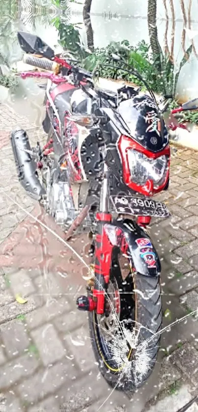 Sleek motorcycle parked in rain on a cobblestone street, vivid red accents.