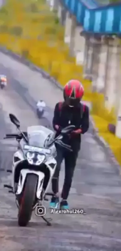 Motorcyclist on roadside with bike helmet.