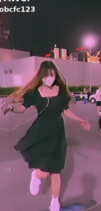 Person dancing at night with stylish outfit and urban backdrop.