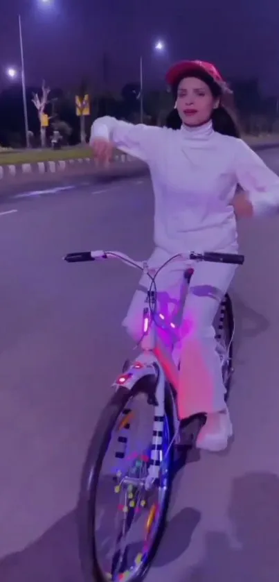 A stylish woman cycling on a neon-lit street at night.