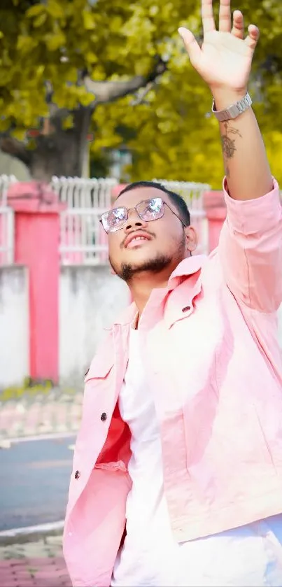 Fashionable person outdoors in stylish pink attire.