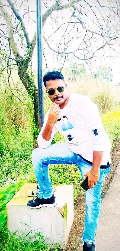 Stylish pose in nature with bright green backdrop.