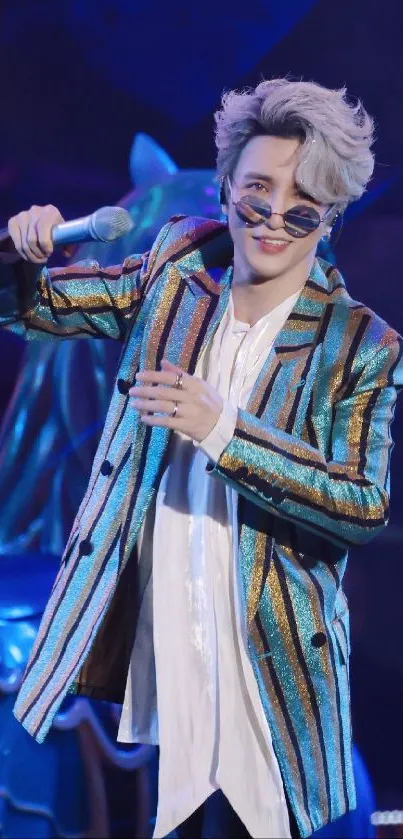 Performer in vibrant striped suit holding a microphone.