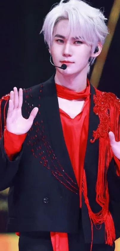 Energetic stage performer in red outfit.