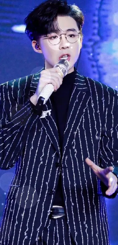 Performer in striped suit on blue stage