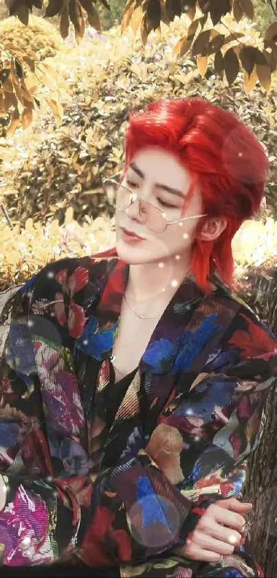 Stylish person with red hair in floral attire sitting outdoors.