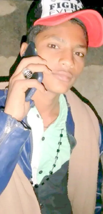 Young man in cap making a phone call.