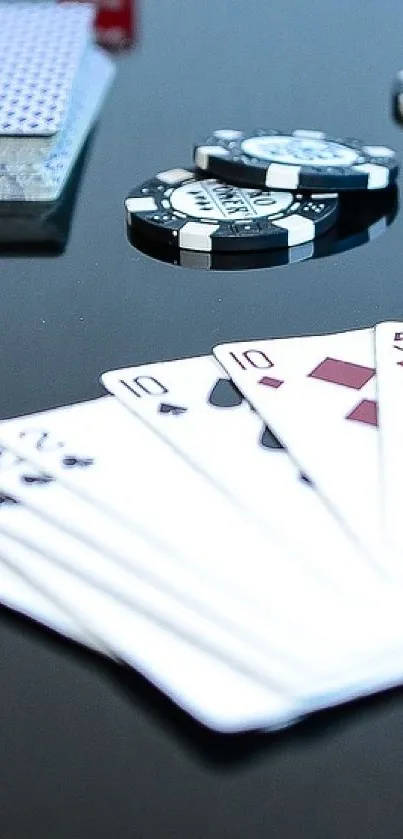 Poker cards and chips on black surface wallpaper.