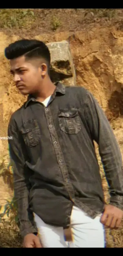 Portrait of a young man in a stylish outdoor setting.