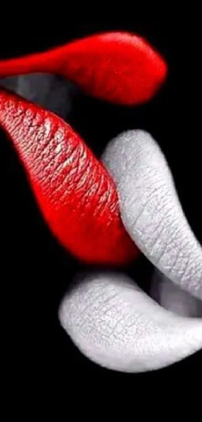 Red and white lips on a black background wallpaper.