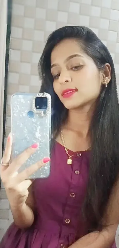 Young woman taking a selfie with smartphone in mirror.