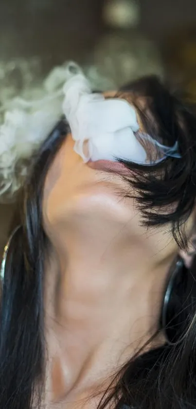 Person with flowing hair exhaling smoke.