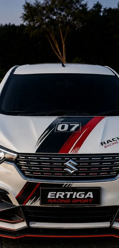 Front view of a sports car with black and red graphics on a sleek design background.