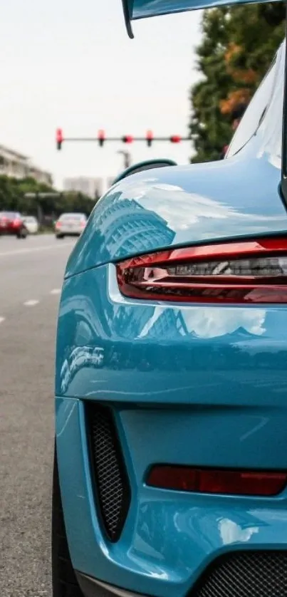 Vibrant blue sports car on city street.