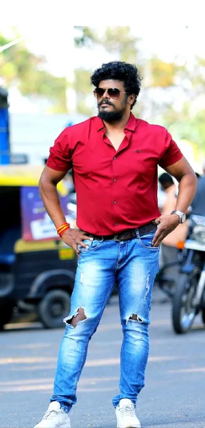 Street style portrait of man in red shirt and jeans.