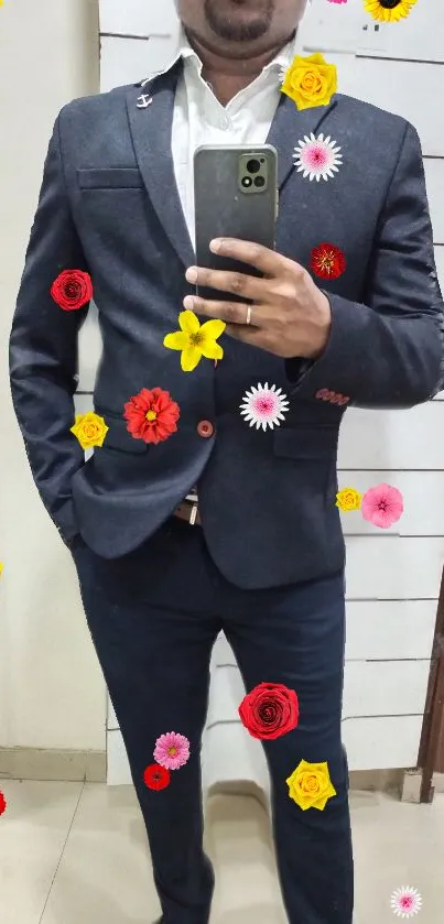 Man in dark suit with colorful flower decorations.