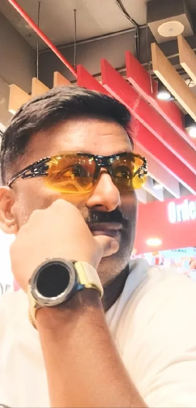 Man wearing sunglasses with stylish background.