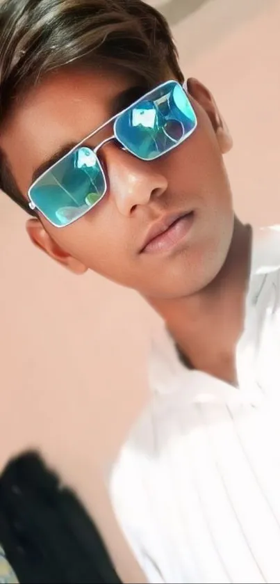 Young man with reflective sunglasses and stylish look.