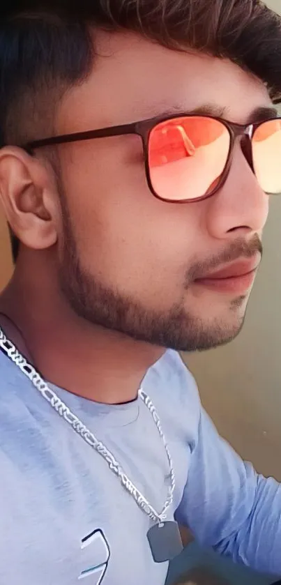 Side profile of a man wearing stylish sunglasses with a trendy hairstyle.