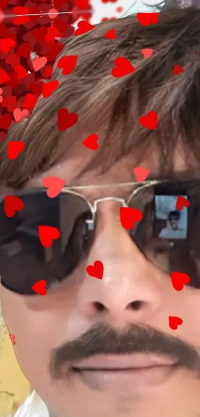 Portrait with sunglasses and red hearts overlay for mobile wallpaper.