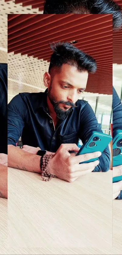 Man in black shirt using blue smartphone at a wooden table.