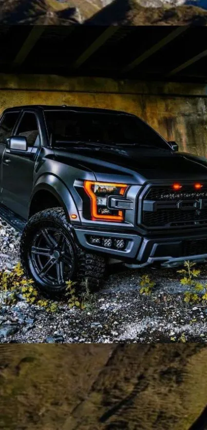 Black truck parked under a bridge, showcasing rugged design and adventure.