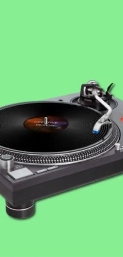 Turntable on a vibrant green background.