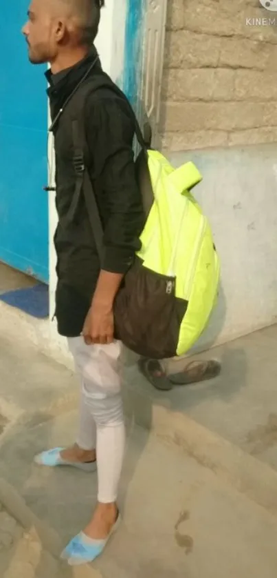 Urban fashion with a bright lime green backpack.