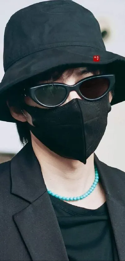 Person in black hat and sunglasses mobile wallpaper.