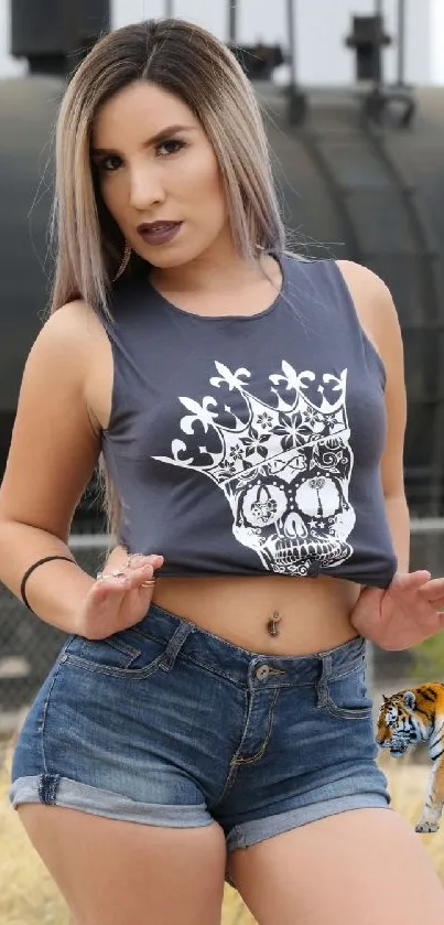 Woman in denim shorts with urban backdrop.
