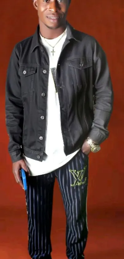 Young man in stylish outfit with brown background.