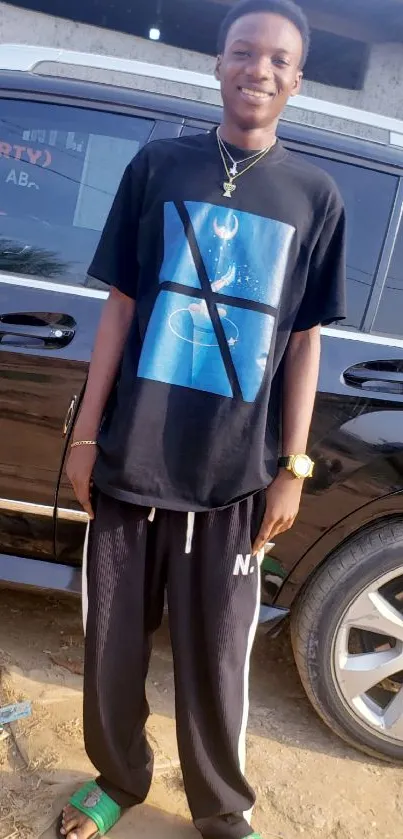 Person wearing trendy casual streetwear in front of a car.