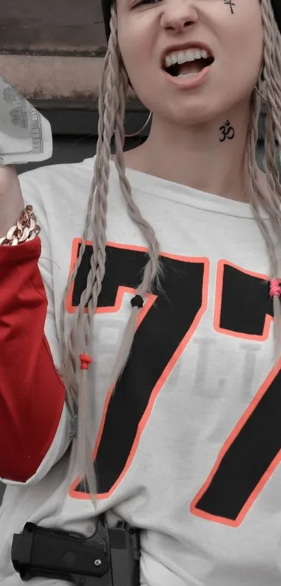 Woman in stylish streetwear with braids and bold 77 shirt.