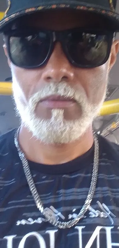 Stylish man in sunglasses on a bus, urban vibe.