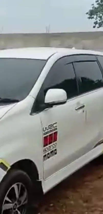 Sleek white car with modern design and black tinted windows.