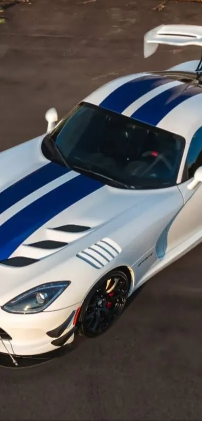 Aerial view of a sleek sports car with racing stripes.