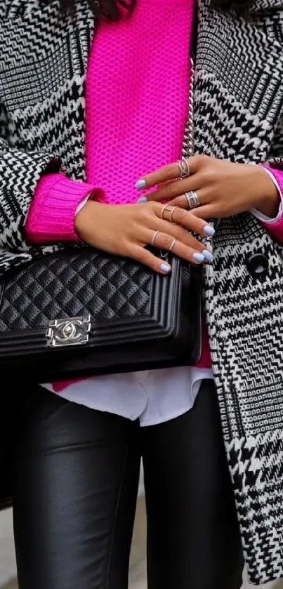 Chic outfit with pink sweater, houndstooth coat, and quilted bag.