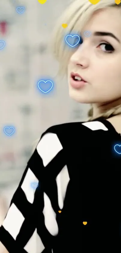 Stylish woman with black and white outfit, surrounded by blue hearts.