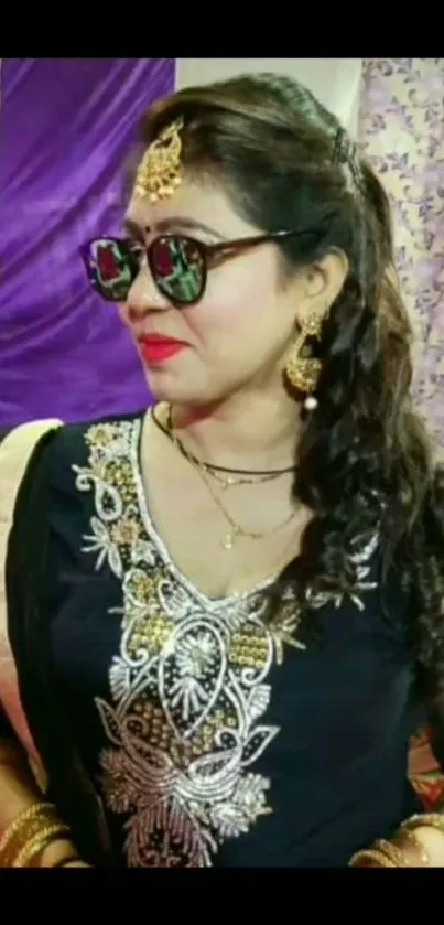 Fashionable woman in traditional festive attire and jewelry.