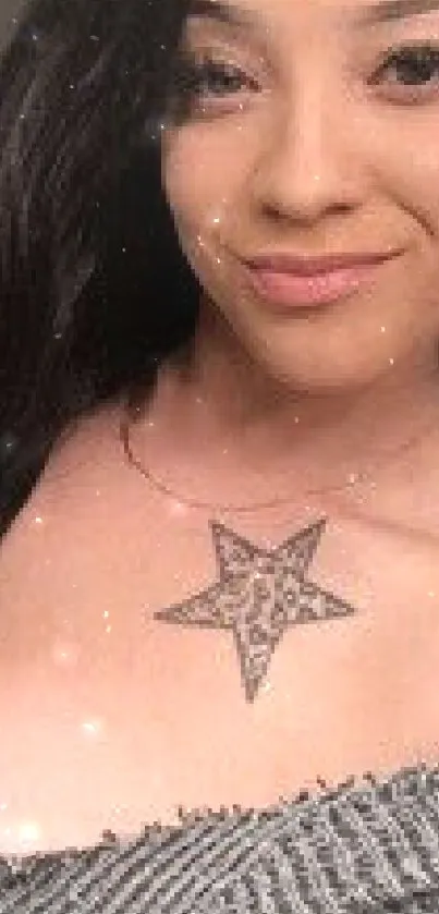 Woman with black hair and a star tattoo, looking stylish.